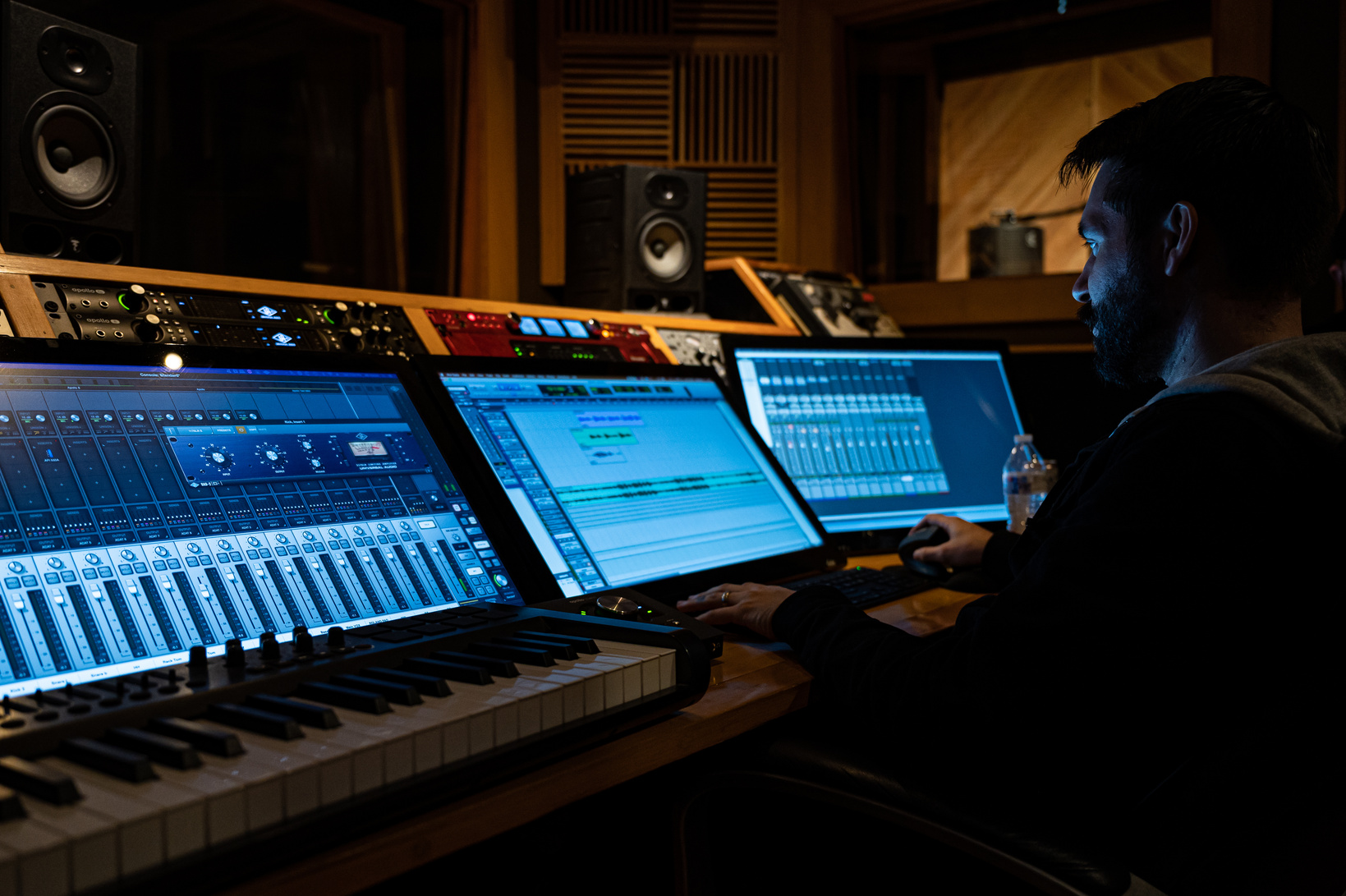 Bearded man working in modern recording studio